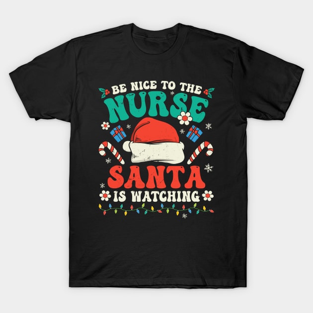 Nurse Christmas Groovy Nice To The Nurse Santa is Watching T-Shirt by ArifLeleu